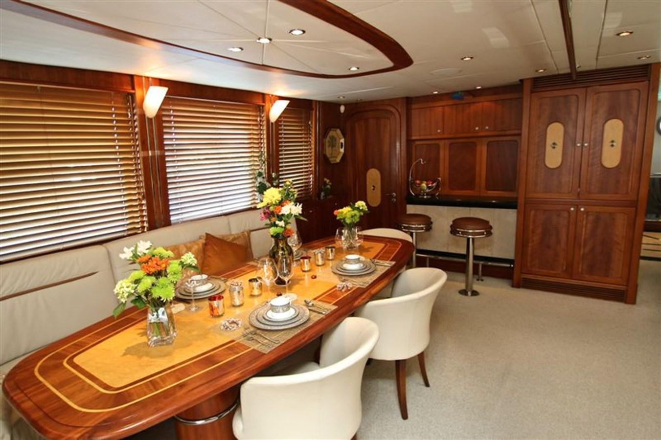 a large kitchen with a dining table aboard IMPETUS Yacht for Sale
