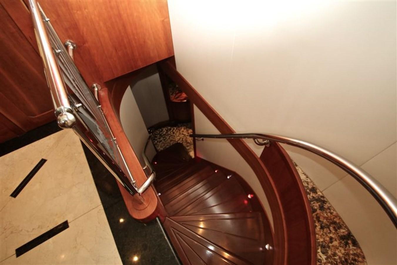 a hallway with a wood door aboard IMPETUS Yacht for Sale