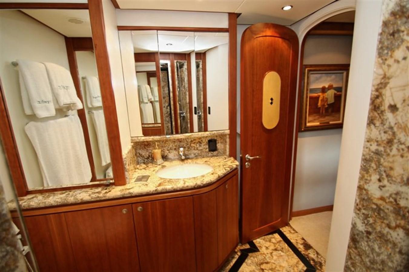 a bathroom with a sink and a mirror aboard IMPETUS Yacht for Sale