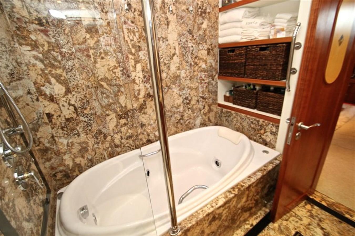 a bathroom with a bathtub aboard IMPETUS Yacht for Sale