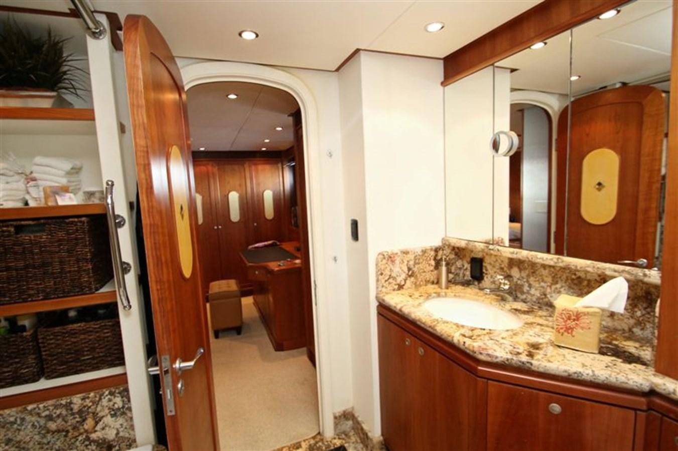 a bathroom with a sink and a mirror aboard IMPETUS Yacht for Sale