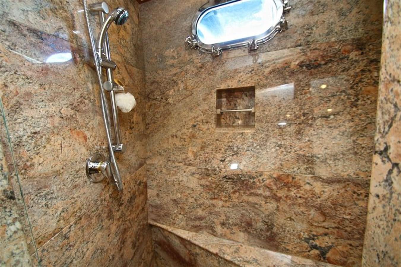 a bathroom with a sink and a mirror aboard IMPETUS Yacht for Sale