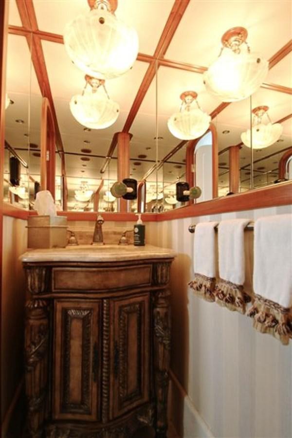a kitchen with lights aboard IMPETUS Yacht for Sale