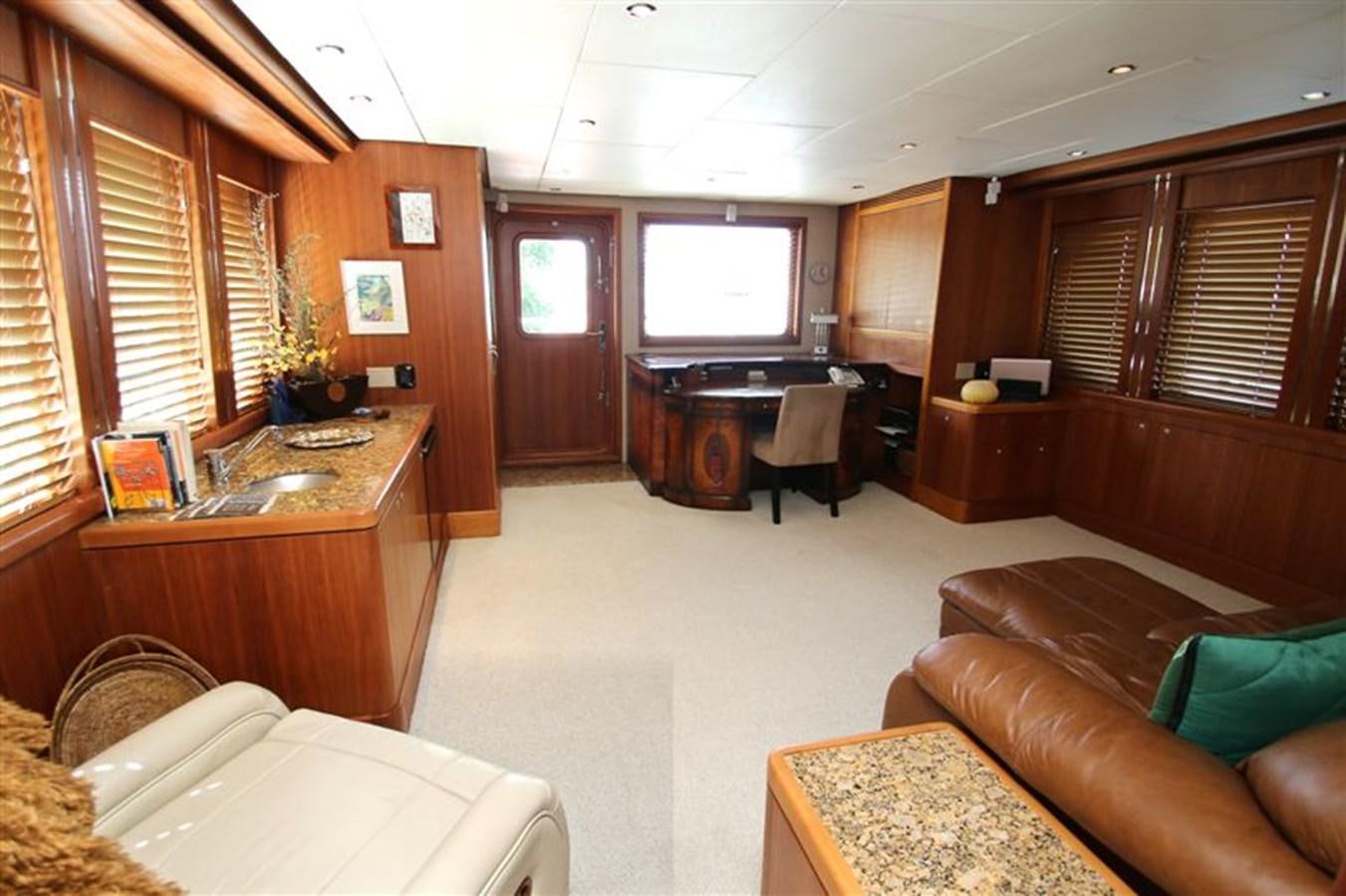 a living room with a couch and a tv aboard IMPETUS Yacht for Sale