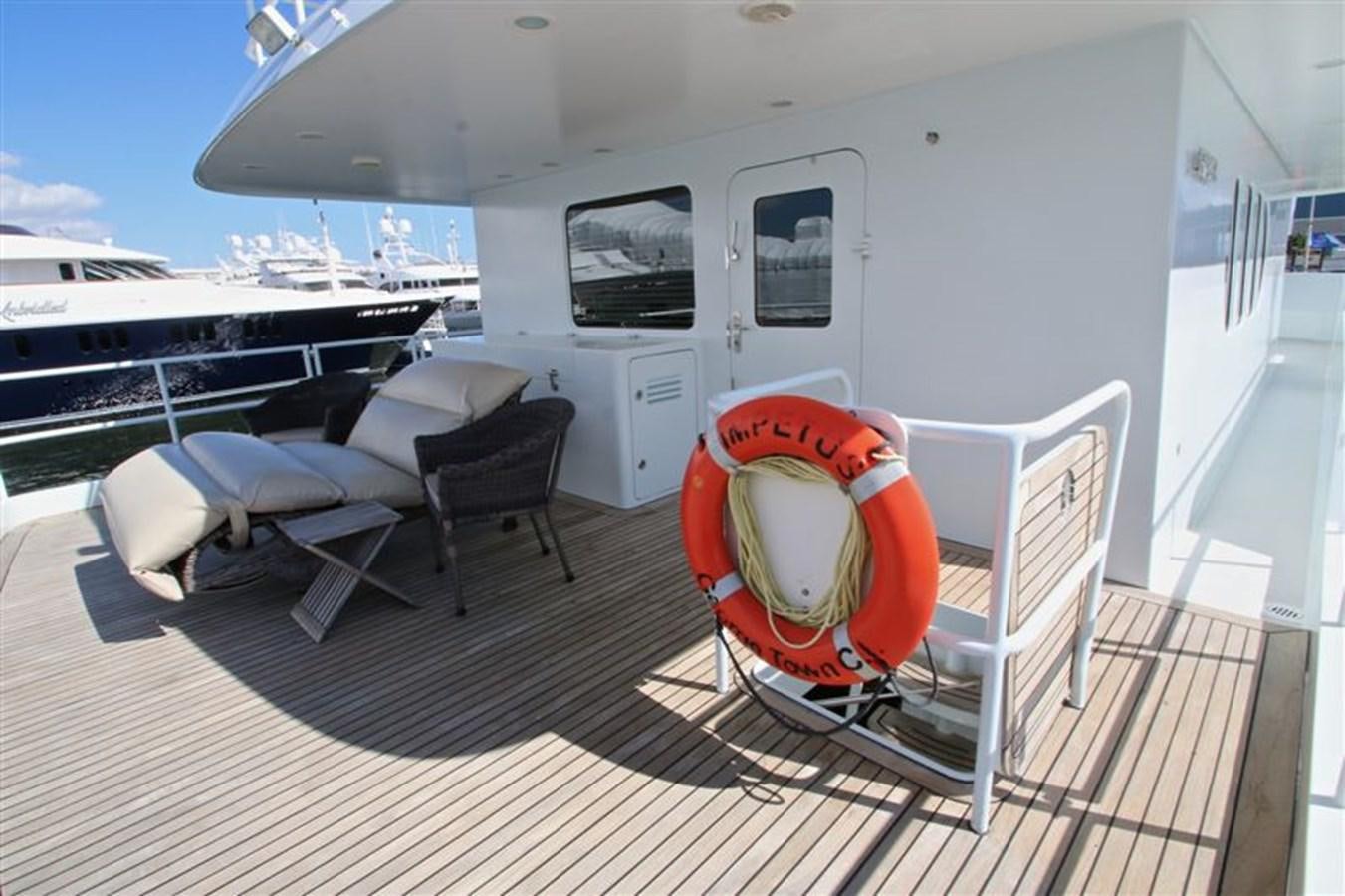 a boat on a deck aboard IMPETUS Yacht for Sale