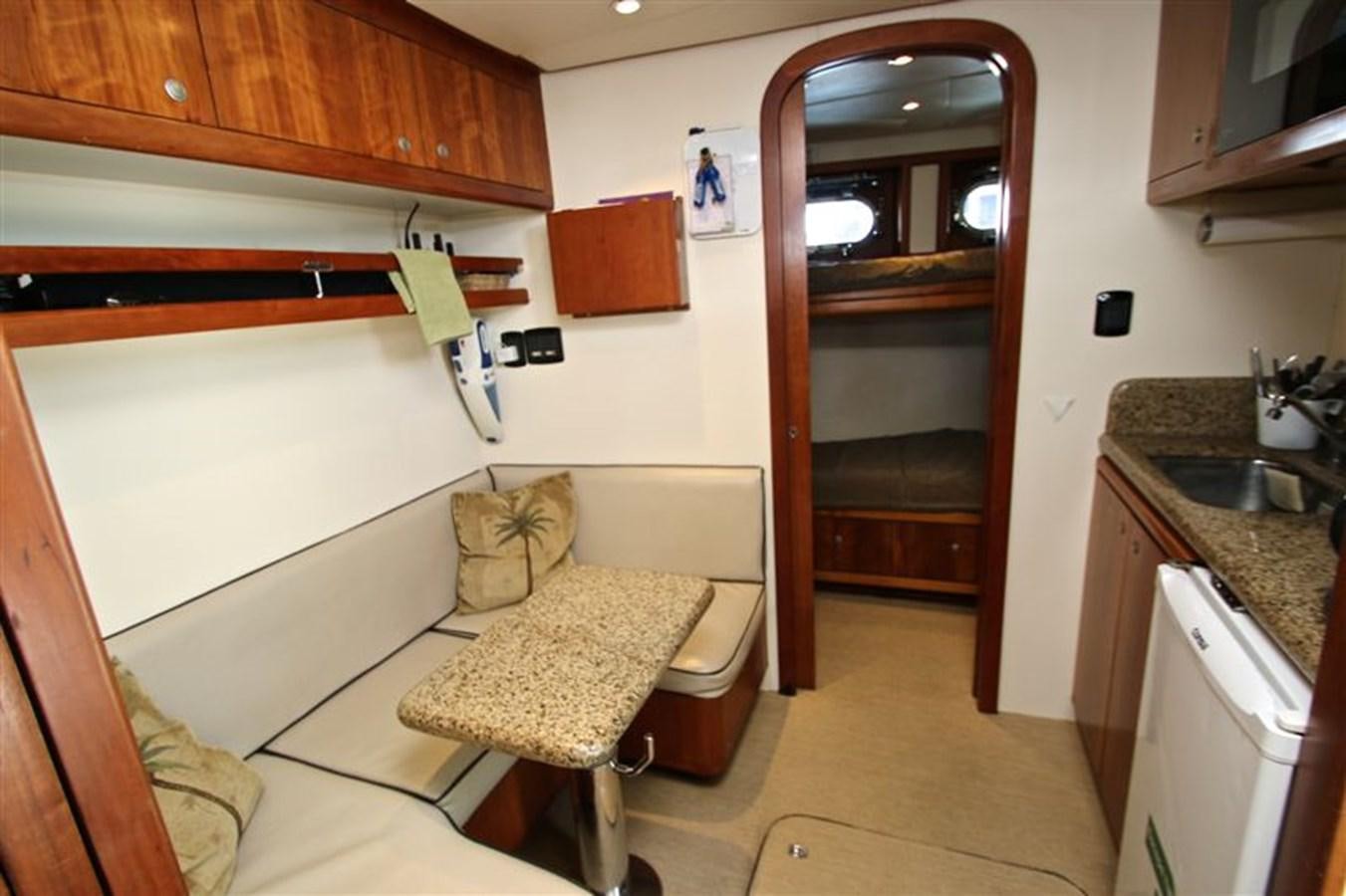 a small bedroom with a bed aboard IMPETUS Yacht for Sale