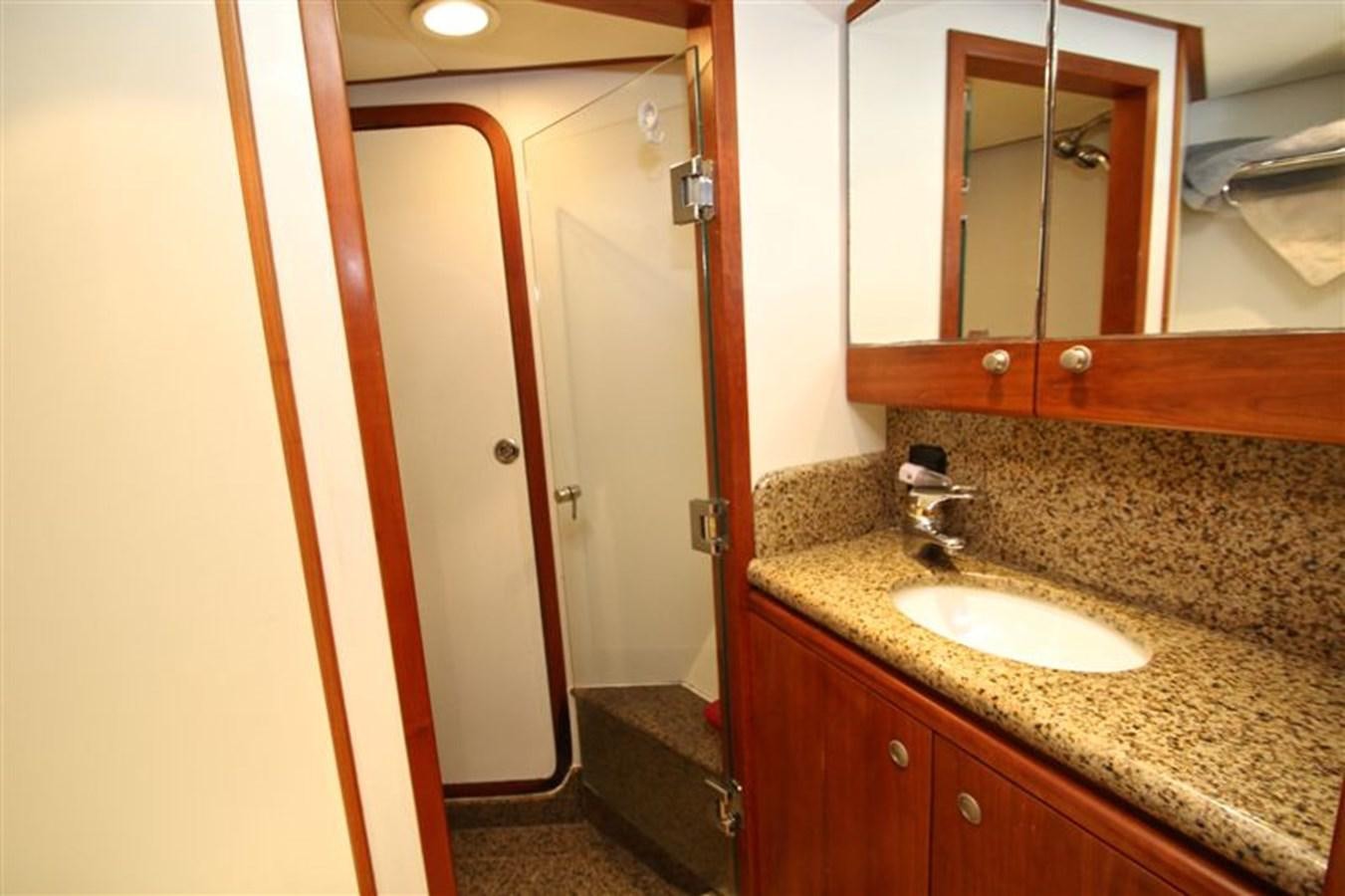a bathroom with a sink and a mirror aboard IMPETUS Yacht for Sale