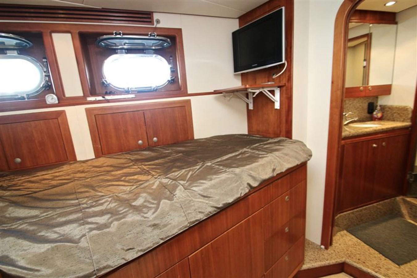 a bed in a room aboard IMPETUS Yacht for Sale