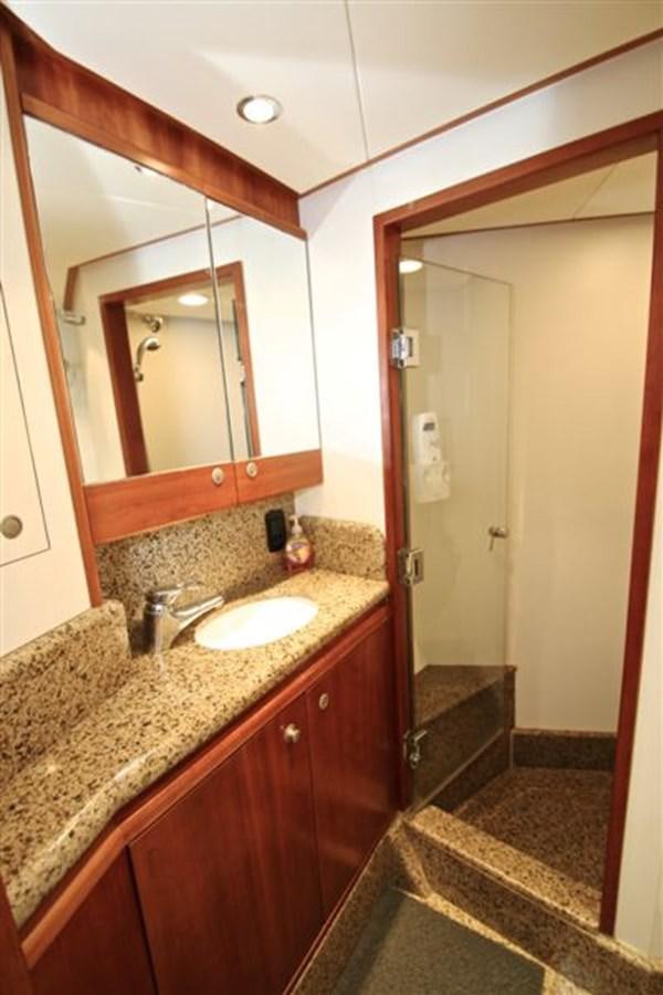 a bathroom with a marble counter top aboard IMPETUS Yacht for Sale