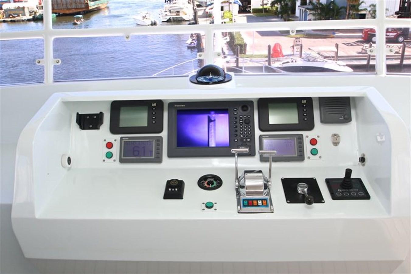 a white machine with buttons and a screen aboard IMPETUS Yacht for Sale