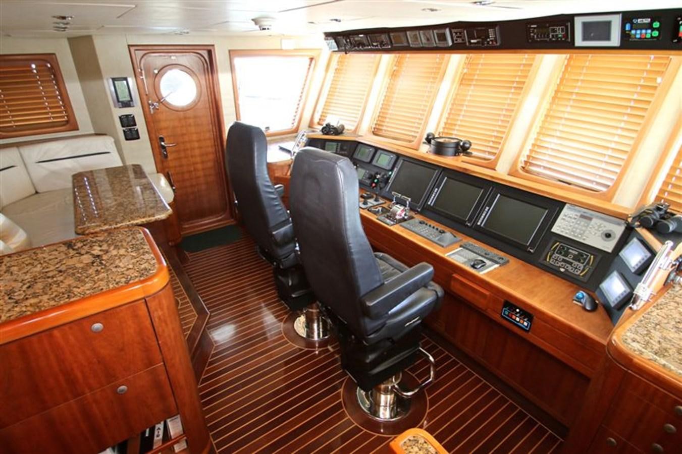 a room with a desk and a chair aboard IMPETUS Yacht for Sale