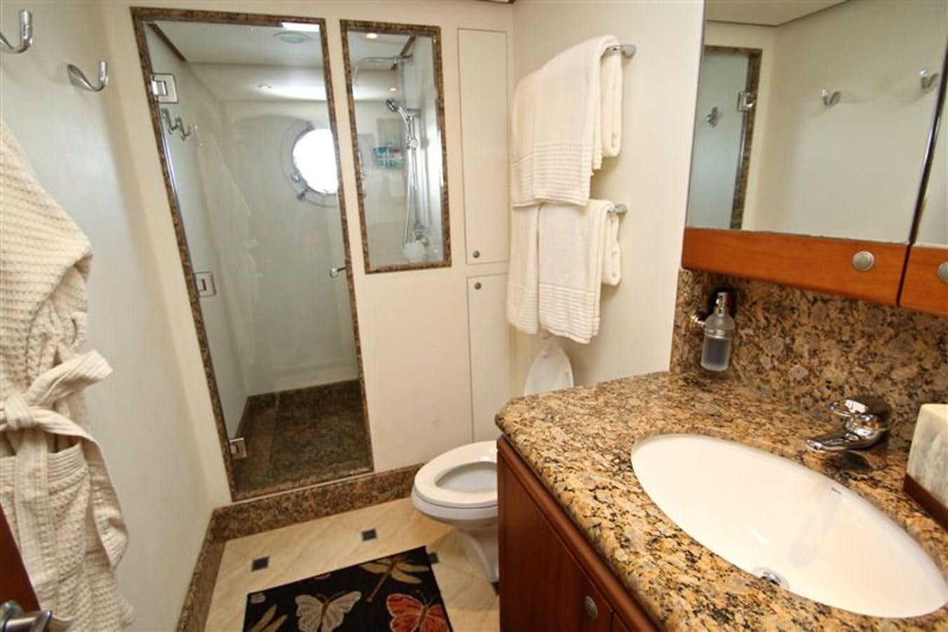 a bathroom with a sink and a toilet aboard IMPETUS Yacht for Sale