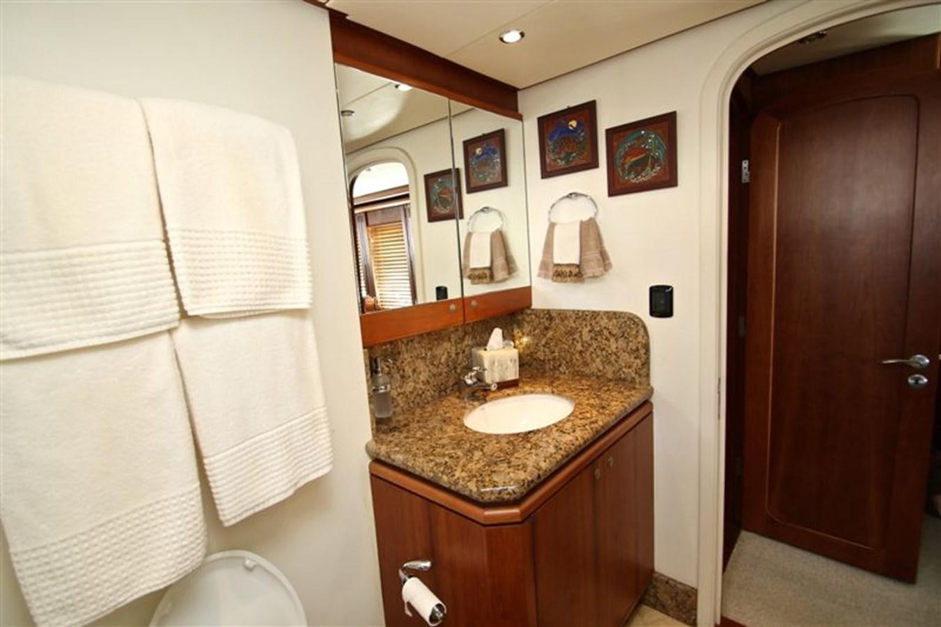 a bathroom with a marble counter top aboard IMPETUS Yacht for Sale
