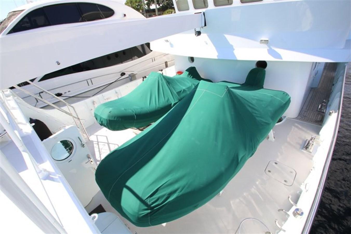 a green and white boat aboard IMPETUS Yacht for Sale