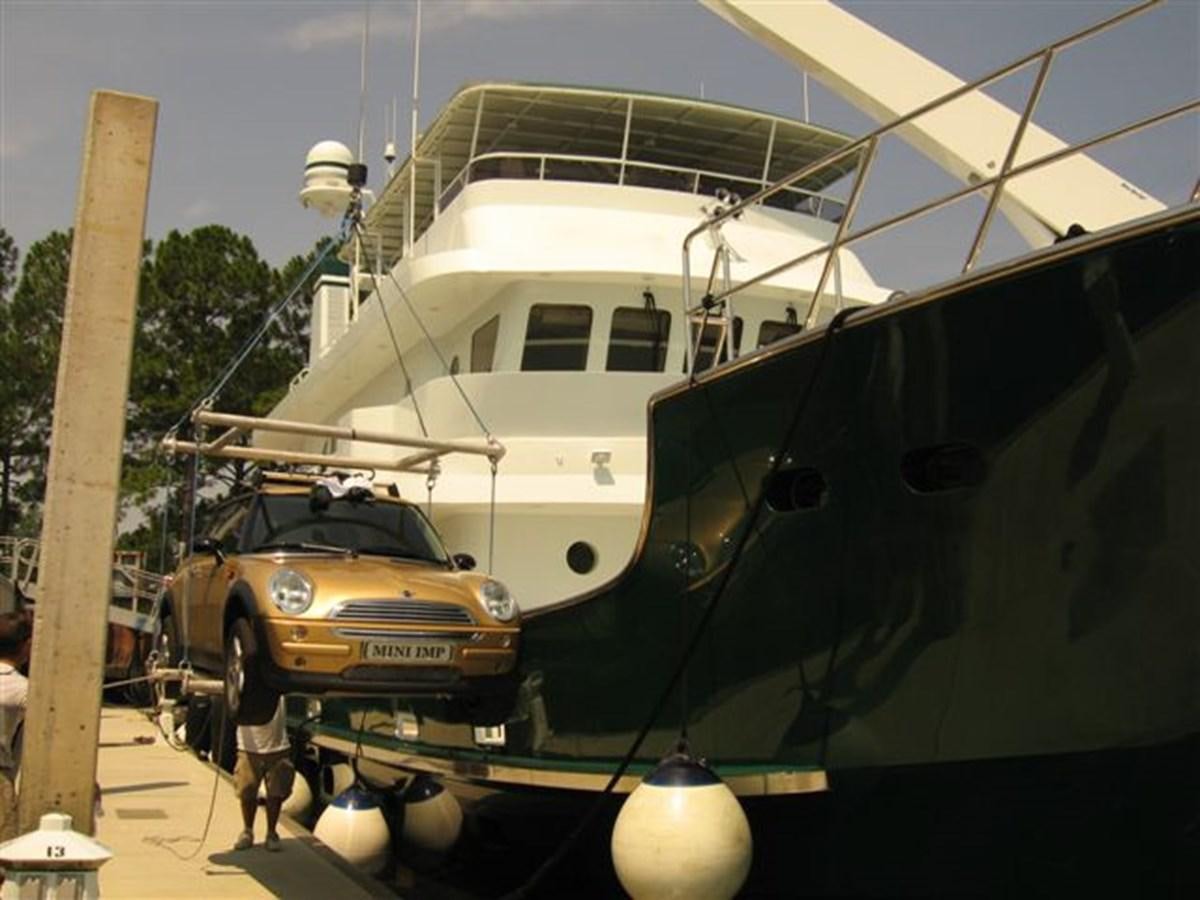 a boat and a car in a museum aboard IMPETUS Yacht for Sale