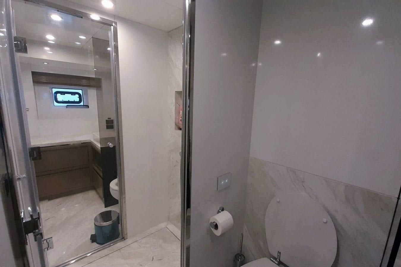 a bathroom with a glass shower aboard SIRENA 68 Yacht for Sale