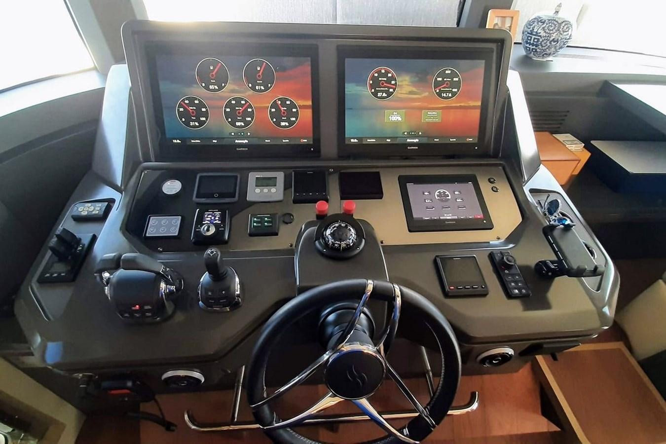 a control panel with a screen and buttons aboard SIRENA 68 Yacht for Sale