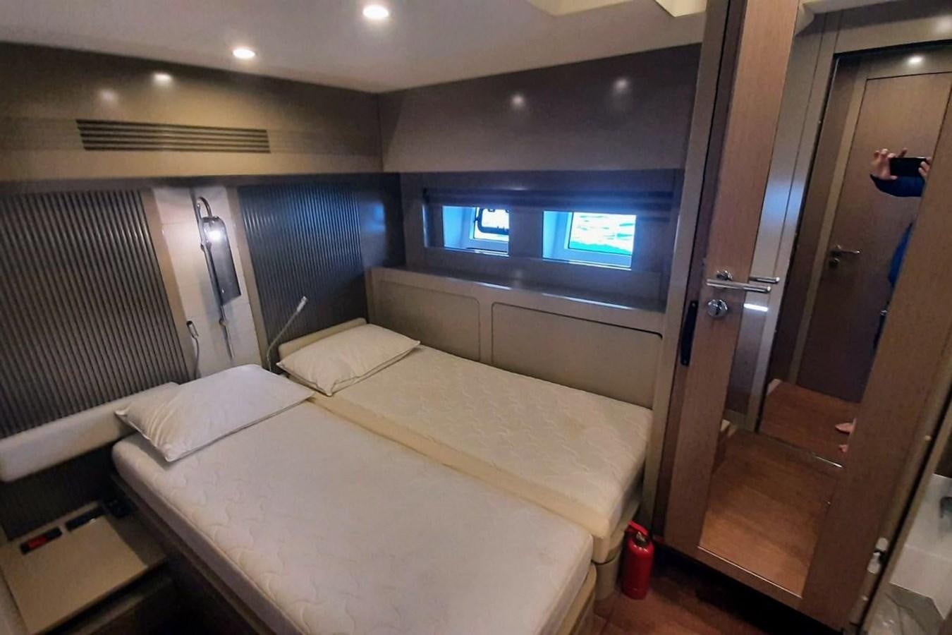 a room with a bed and a tv aboard SIRENA 68 Yacht for Sale