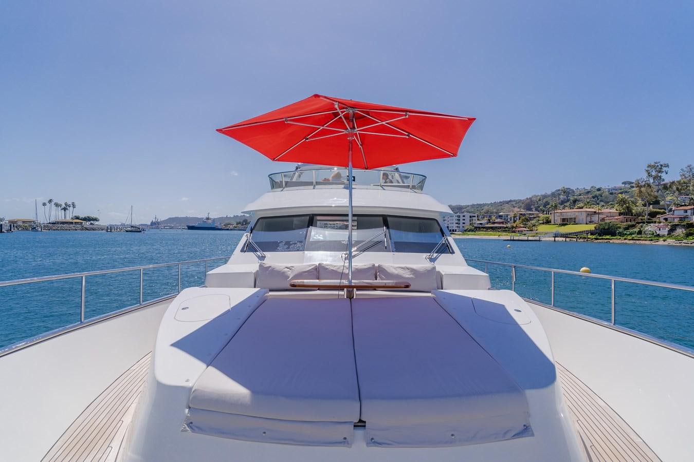 a red umbrella on a boat aboard GYRFALCON Yacht for Sale