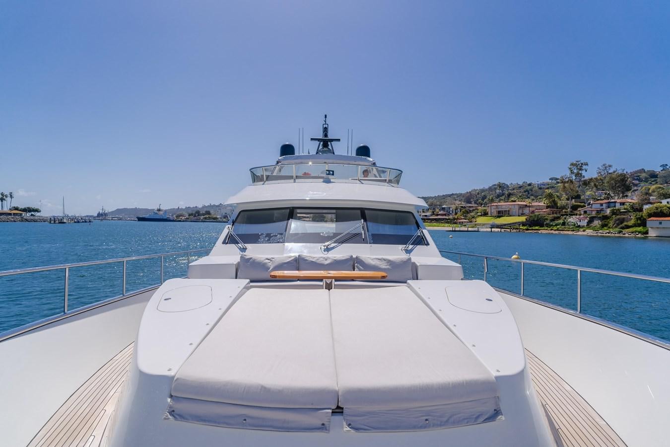 a white boat on a dock aboard GYRFALCON Yacht for Sale