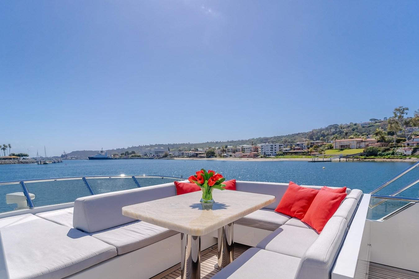 a table with a flower on it on a boat aboard GYRFALCON Yacht for Sale