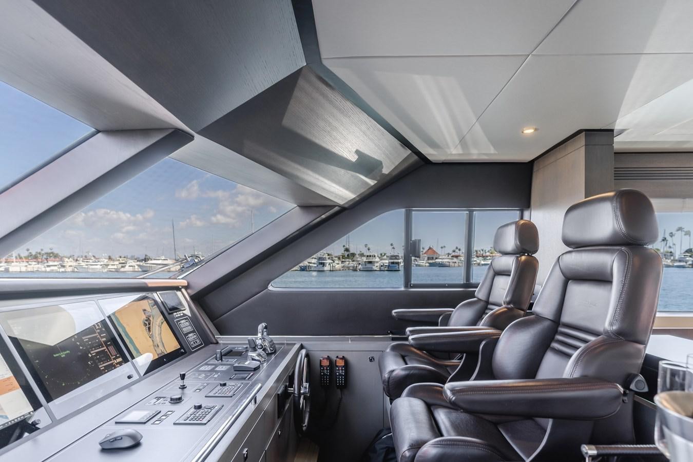 inside of a vehicle with a view of a city and water aboard GYRFALCON Yacht for Sale