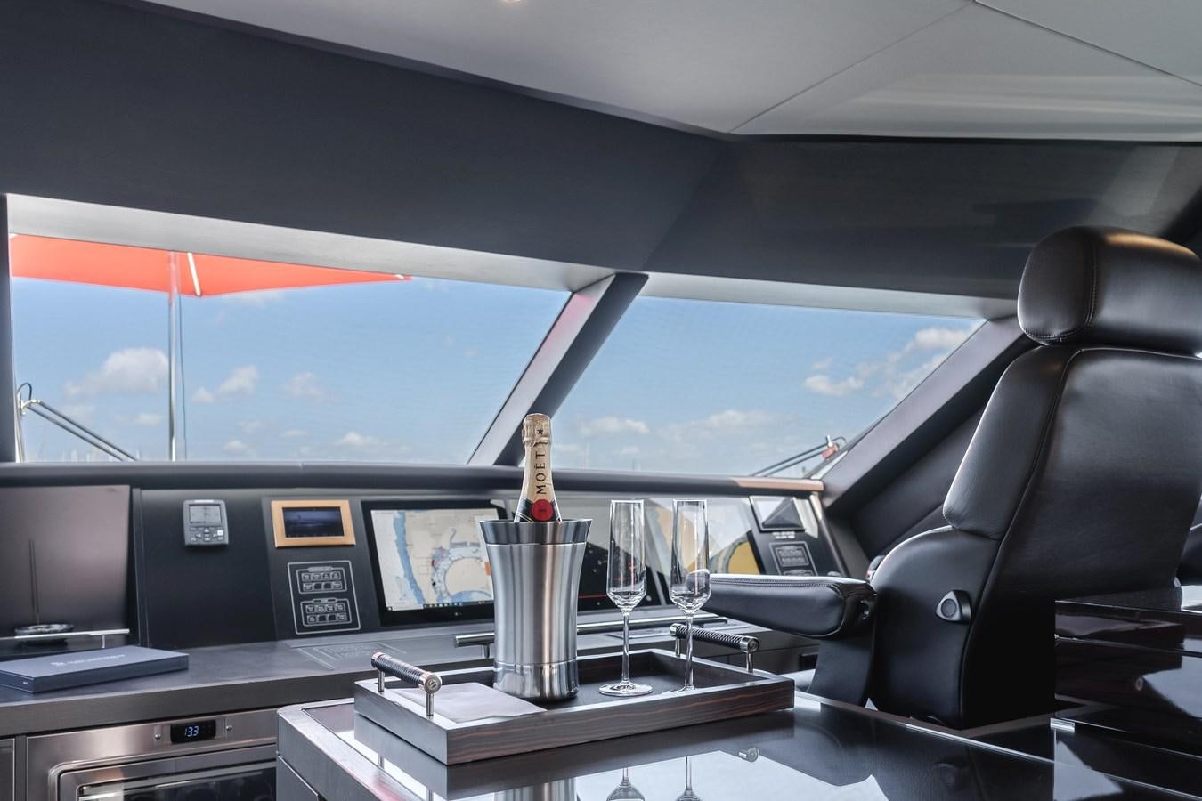 a bottle of champagne in a car aboard GYRFALCON Yacht for Sale