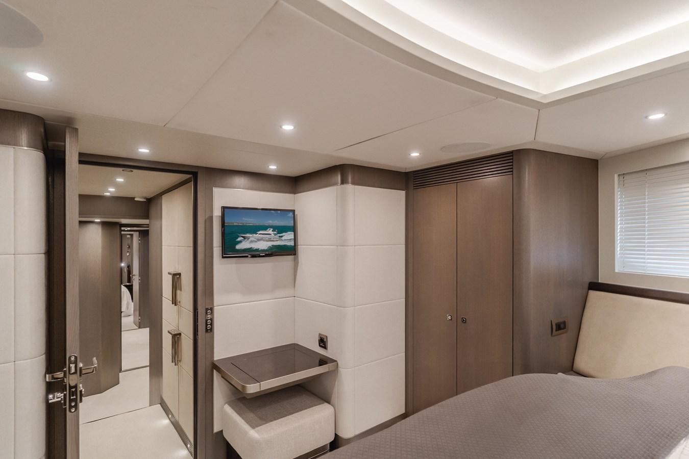 a hotel room with a bed and a tv aboard GYRFALCON Yacht for Sale
