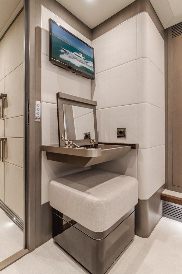 a bathroom with a large tv aboard GYRFALCON Yacht for Sale
