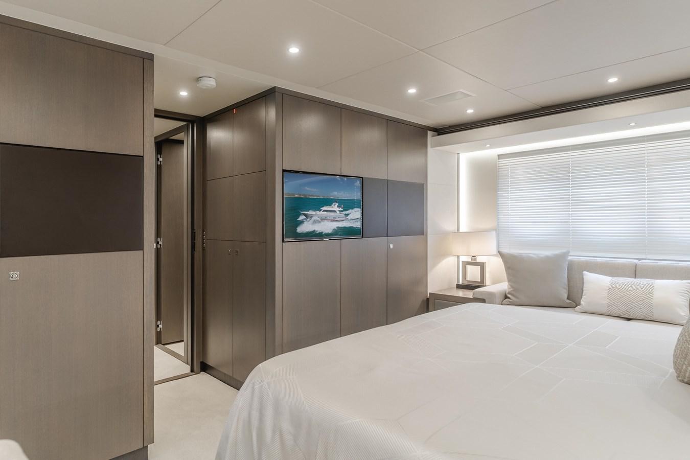 a hotel room with a bed aboard GYRFALCON Yacht for Sale