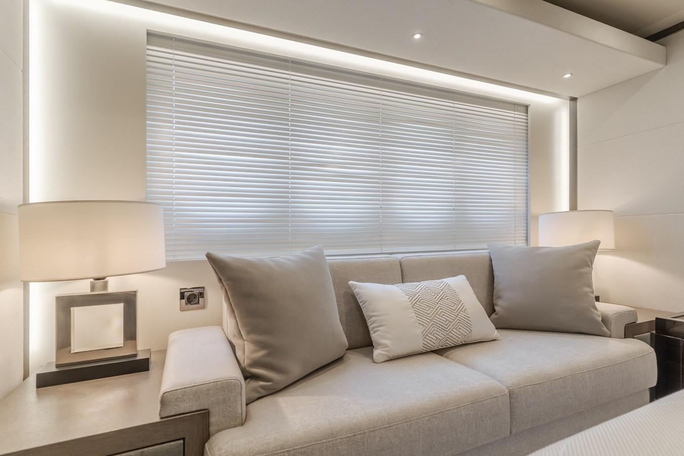 a couch with pillows aboard GYRFALCON Yacht for Sale