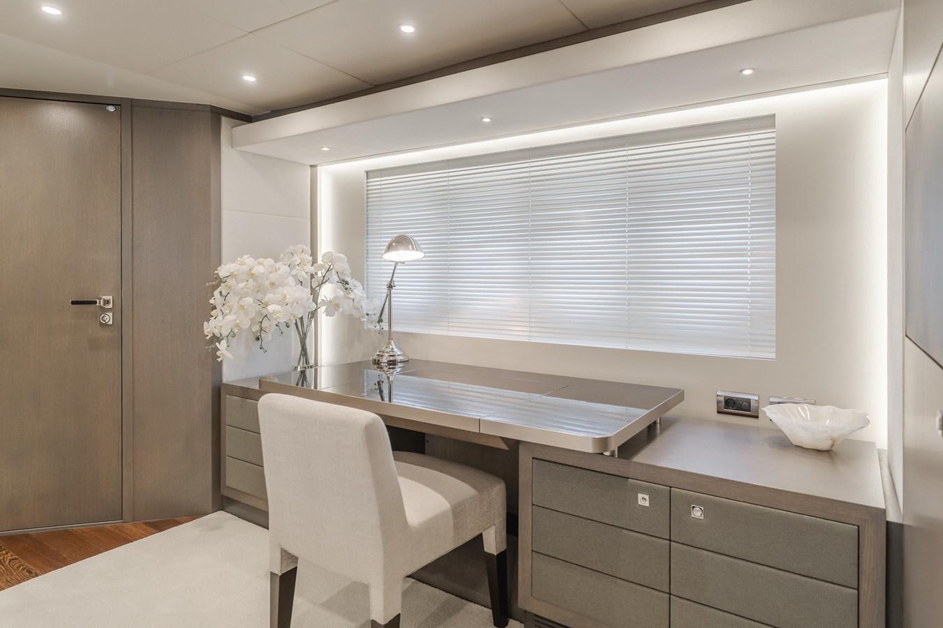 a kitchen with a table and chairs aboard GYRFALCON Yacht for Sale