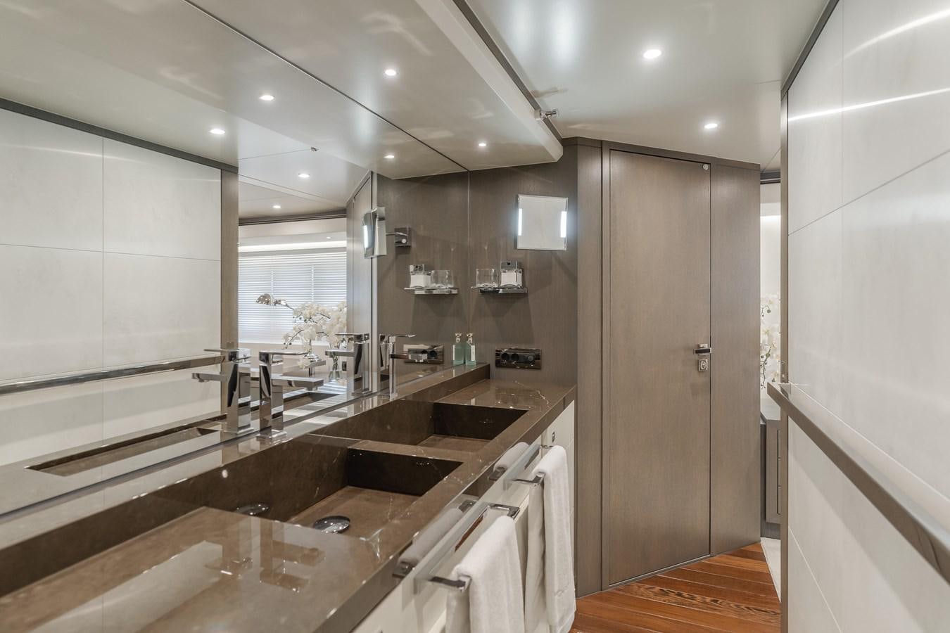 a bathroom with a large countertop aboard GYRFALCON Yacht for Sale