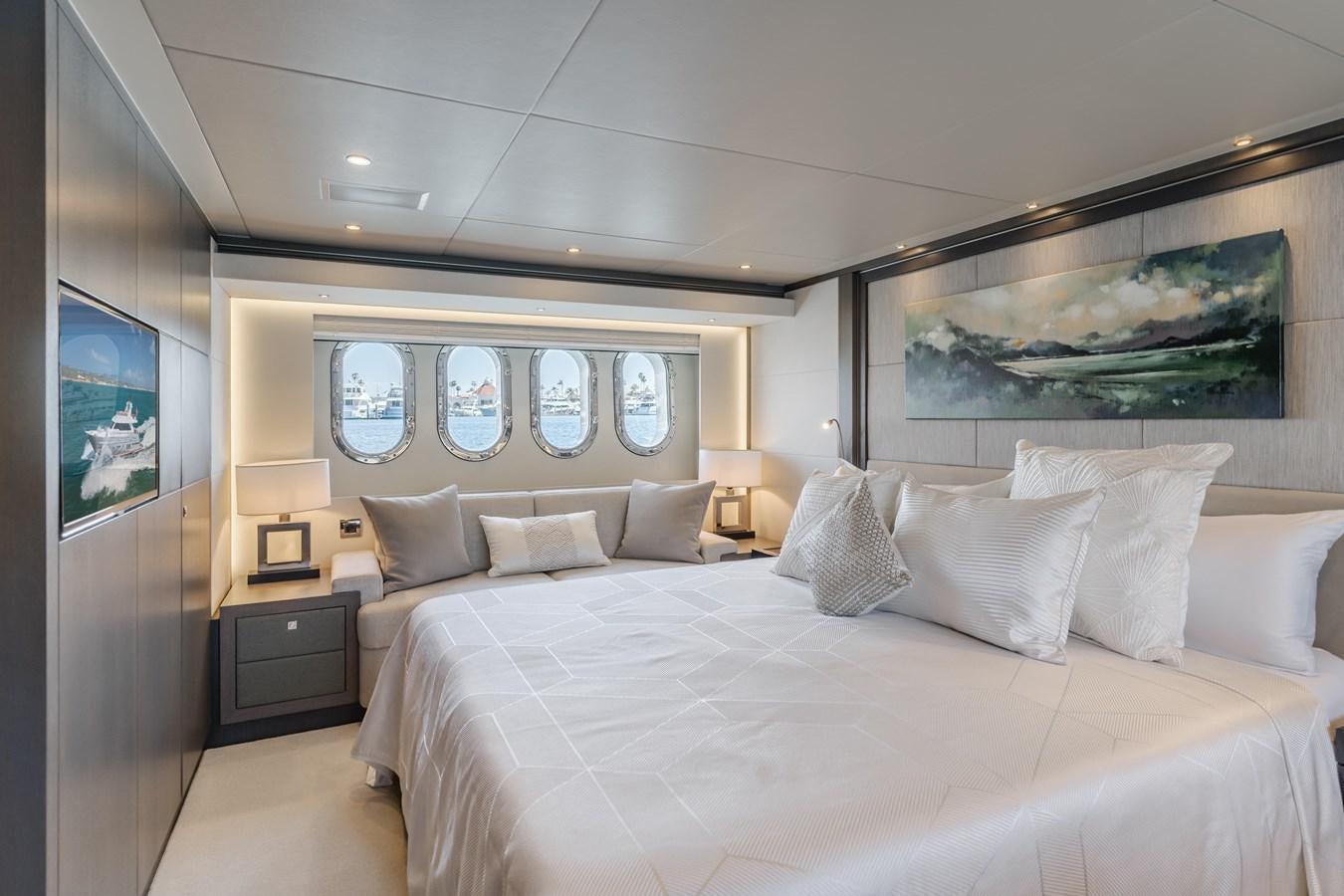 a large bed with white pillows aboard GYRFALCON Yacht for Sale