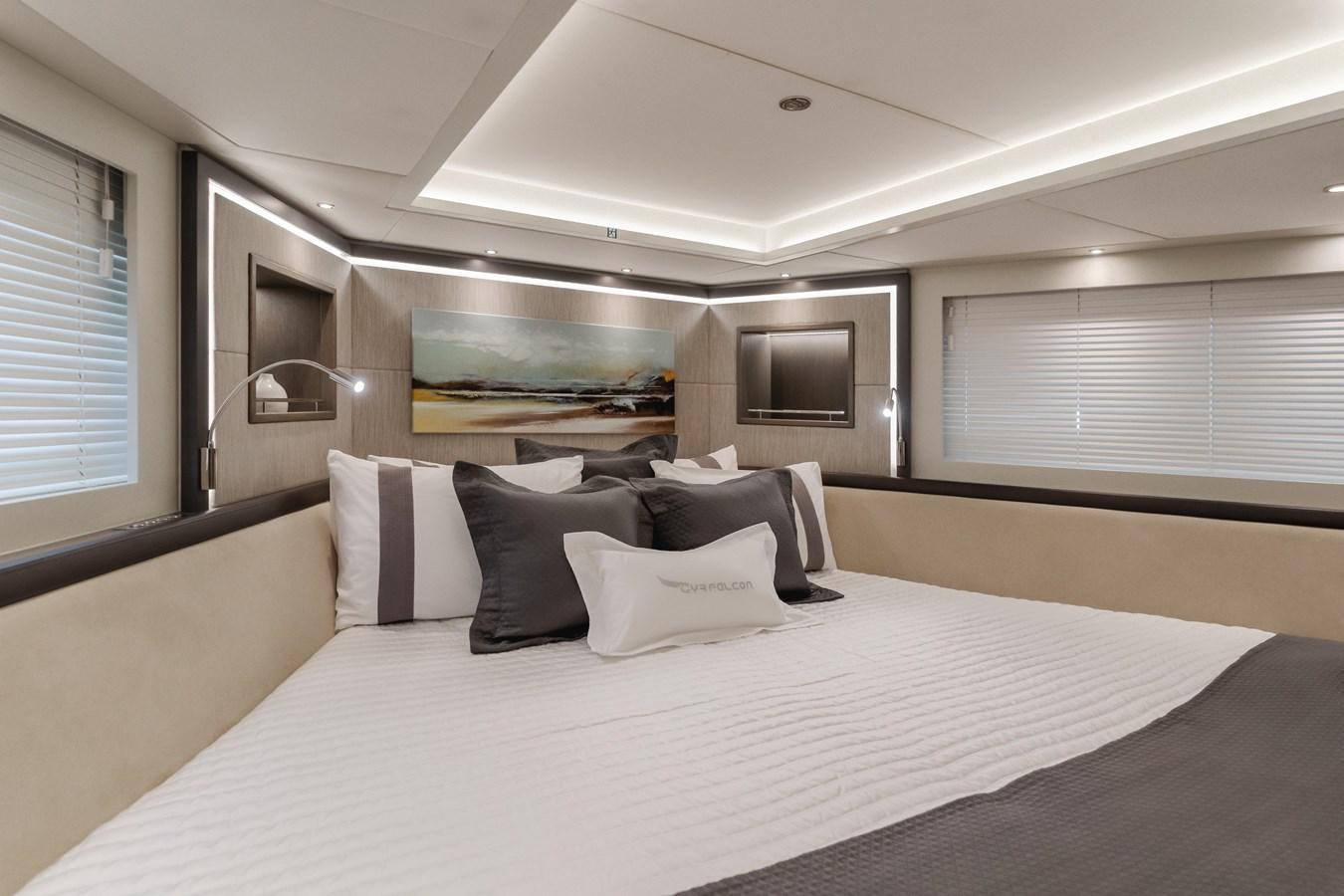 a large bed with white sheets aboard GYRFALCON Yacht for Sale