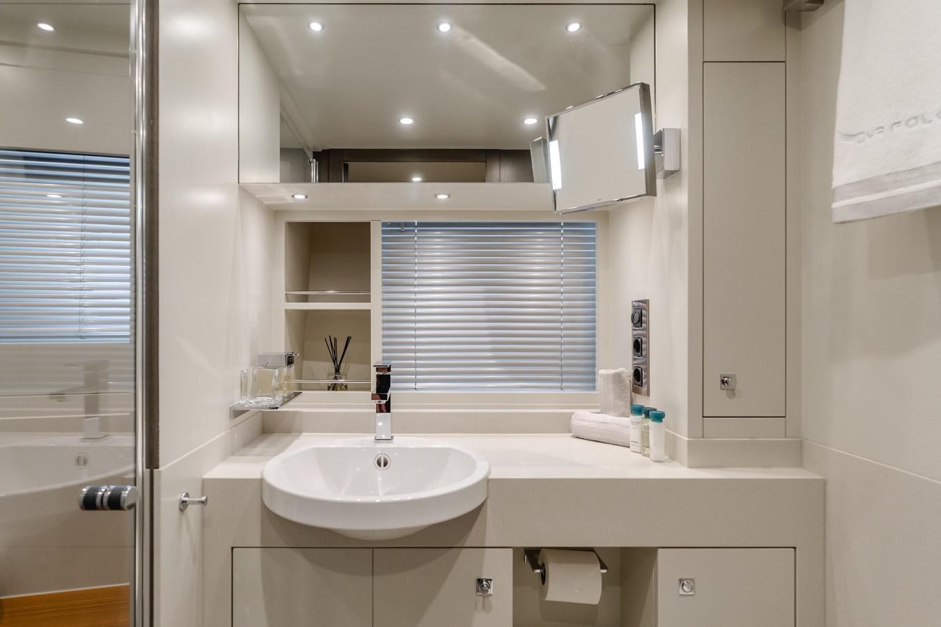 a bathroom with a sink and cabinets aboard GYRFALCON Yacht for Sale