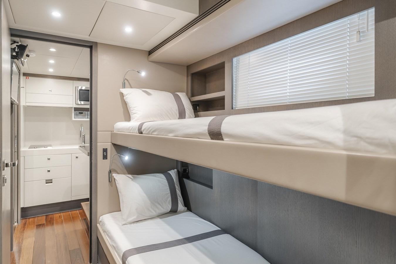 a room with two beds aboard GYRFALCON Yacht for Sale
