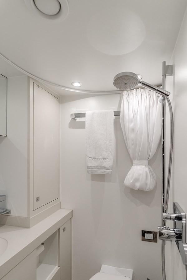a shower with towels from the ceiling aboard GYRFALCON Yacht for Sale