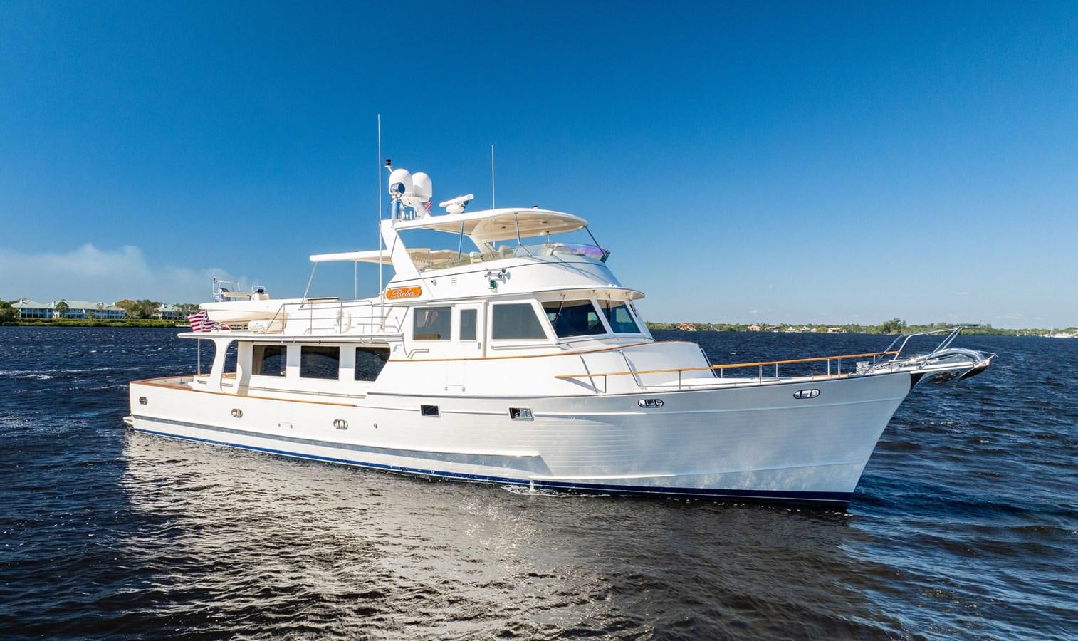 a large white boat on the water aboard BEBA Yacht for Sale
