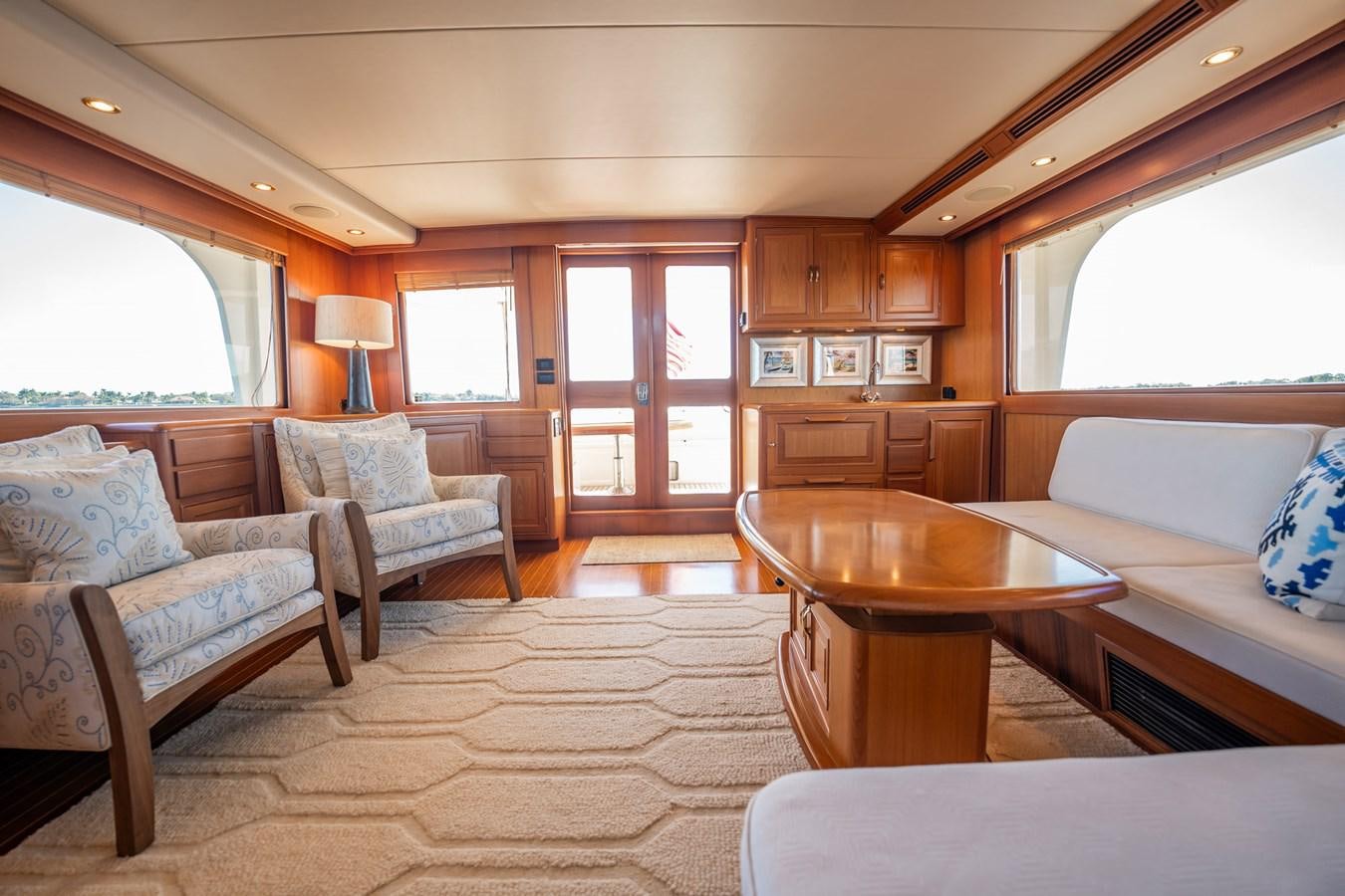 a living room with a kitchen and dining area aboard BEBA Yacht for Sale
