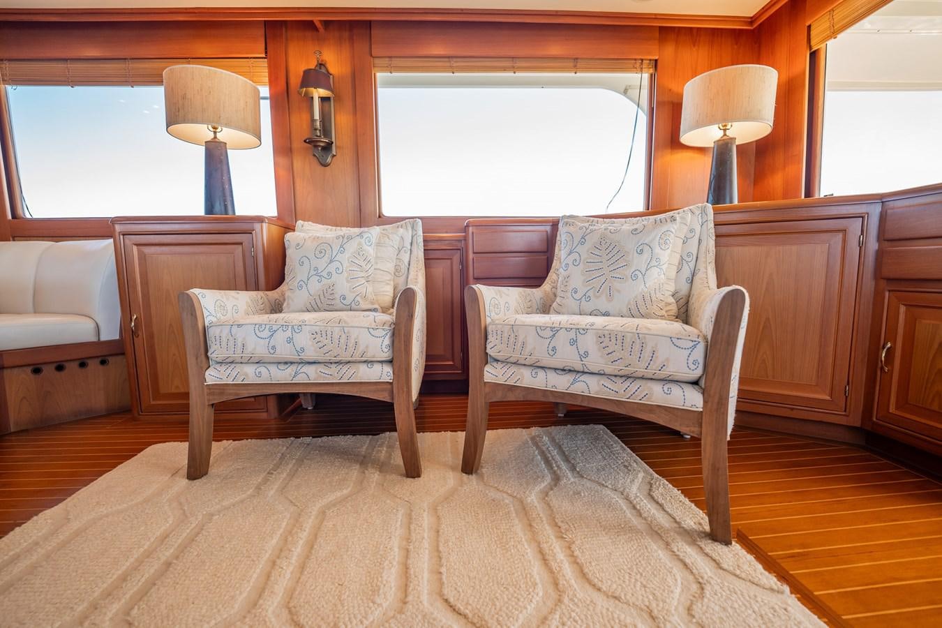 a living room with a couch and a chair aboard BEBA Yacht for Sale