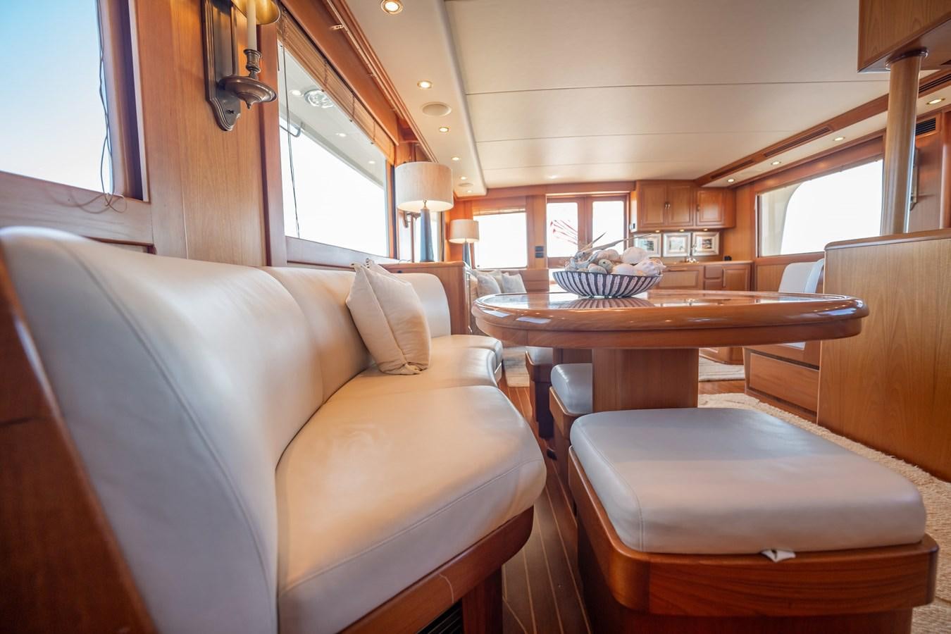 a living room with a couch and a table aboard BEBA Yacht for Sale