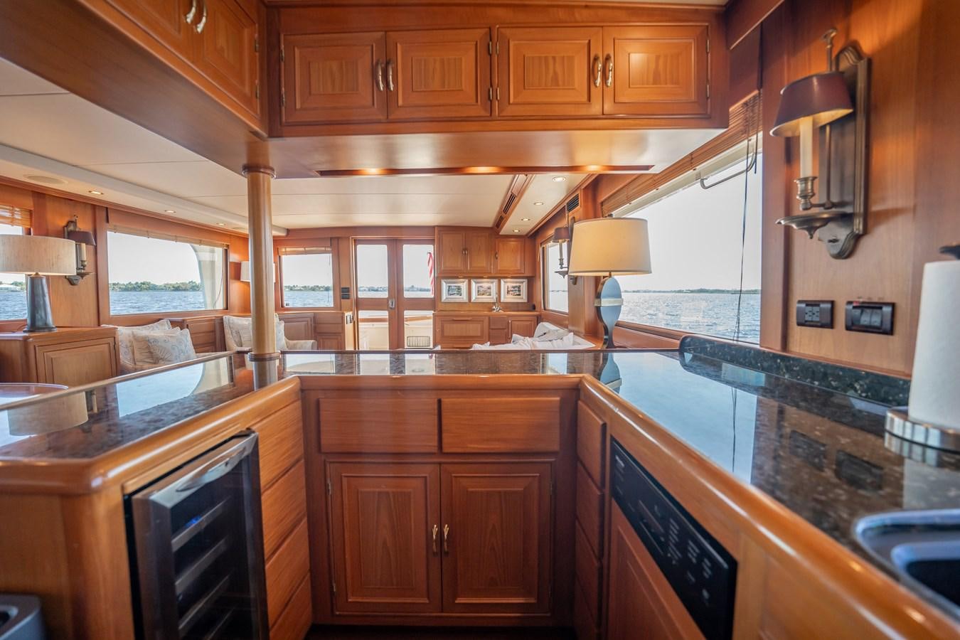 a kitchen with wooden cabinets aboard BEBA Yacht for Sale