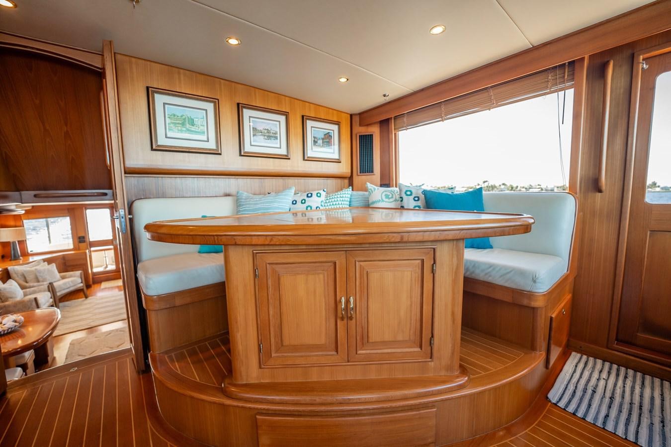 a room with a table and chairs aboard BEBA Yacht for Sale