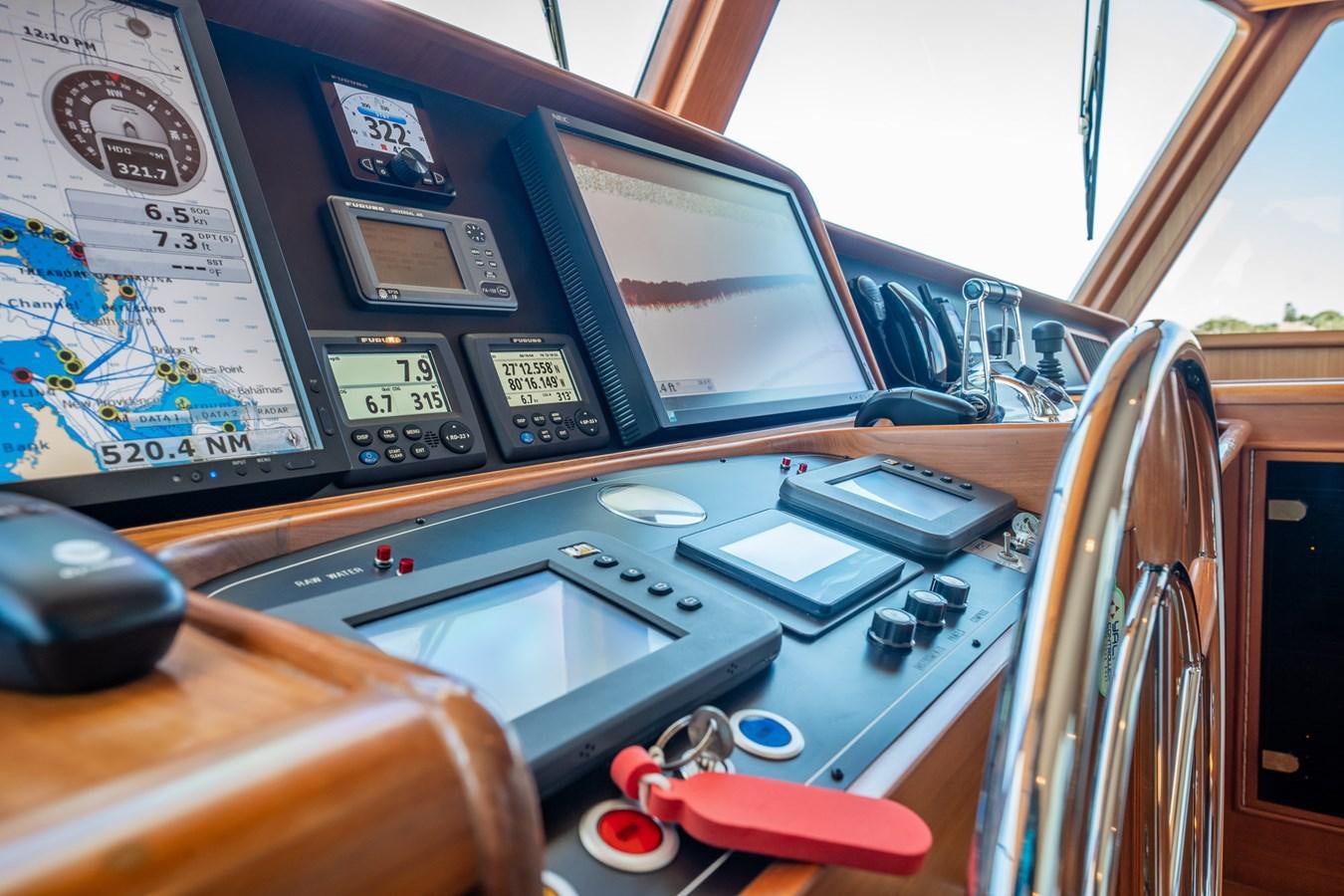 a control panel with a monitor and other electronics aboard BEBA Yacht for Sale