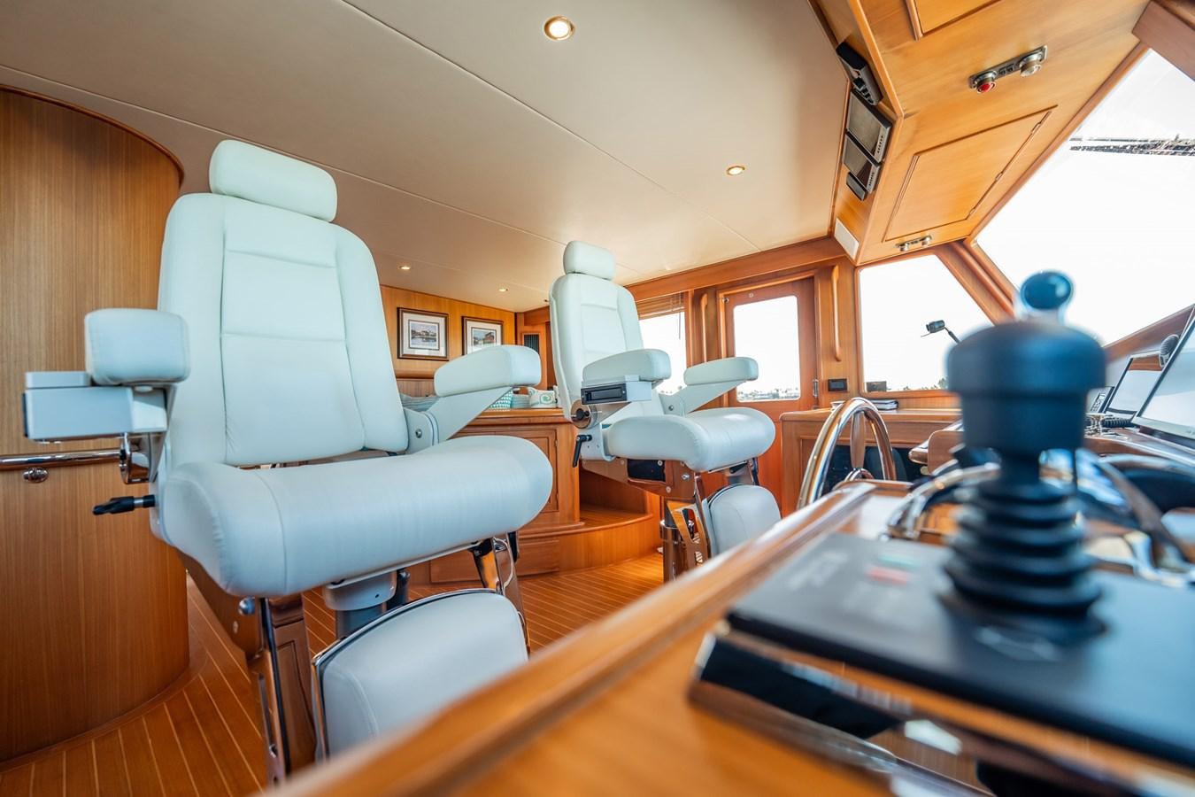 a room with a table and chairs aboard BEBA Yacht for Sale