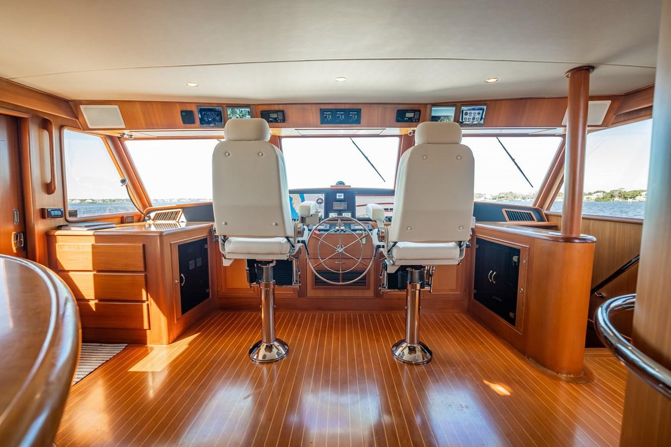 a room with a large window and a large machine on the side aboard BEBA Yacht for Sale