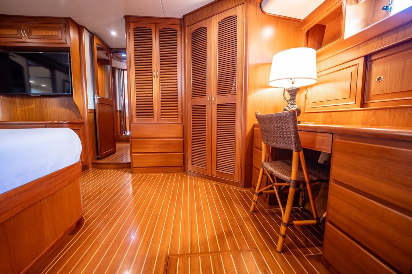 a kitchen with wooden cabinets aboard BEBA Yacht for Sale
