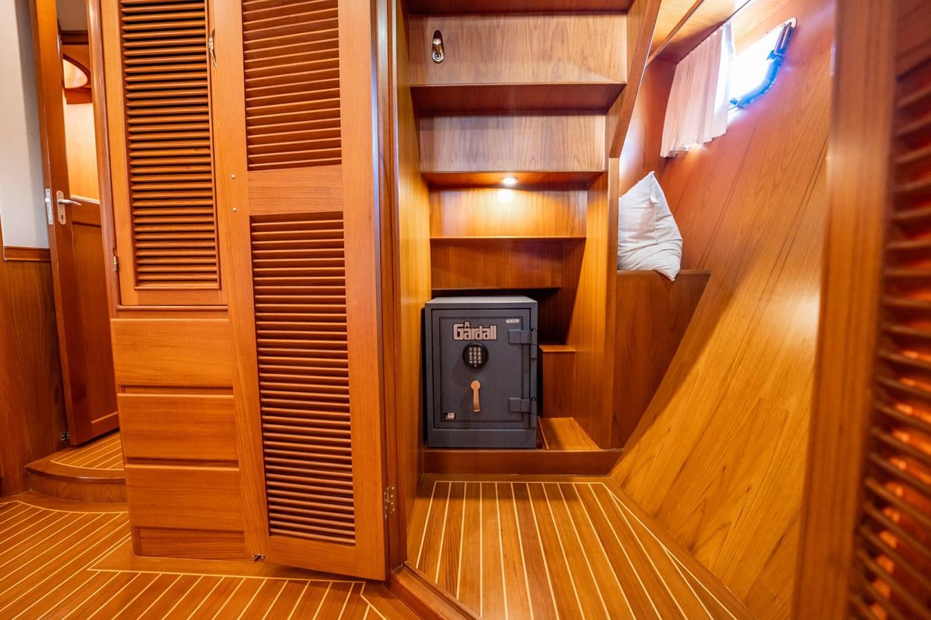 a wood cabinet with a vent aboard BEBA Yacht for Sale