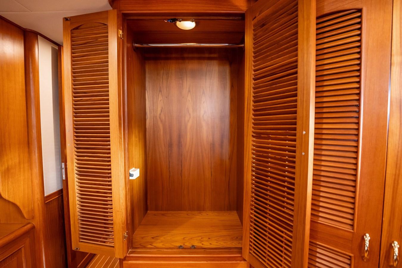 a room with wooden doors aboard BEBA Yacht for Sale